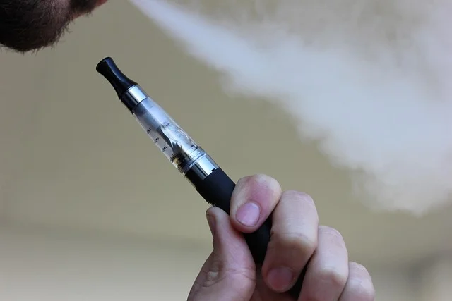 foger cool mint pod device next to an ice cube with vapor rising
